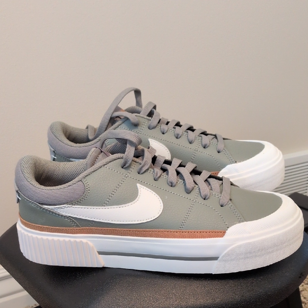 Women's Nike Court Legacy Lift Shoes. The Color Is A Light Army Green And White.